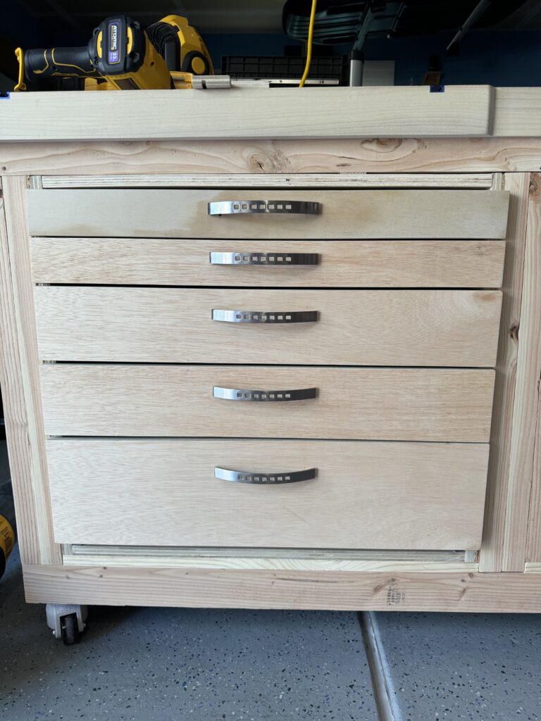 Cabinet with drawer fronts and handles